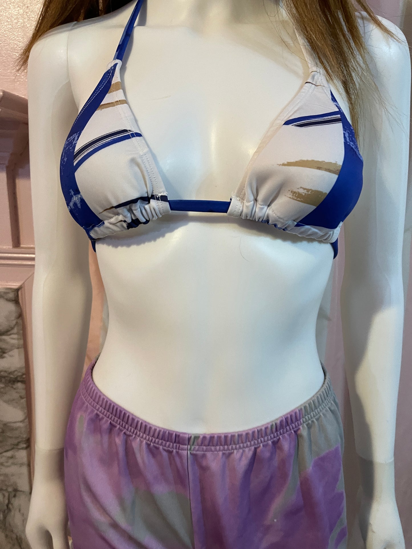 Purple leggings and blue bikini top