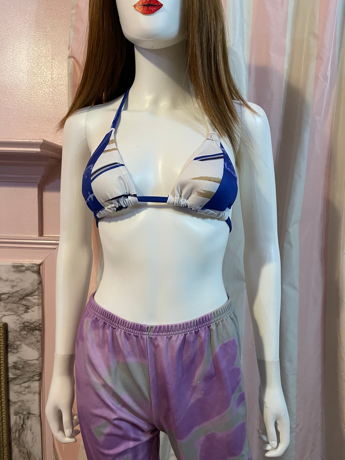 Purple leggings and blue bikini top