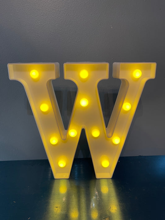 White Letter “W” lighted